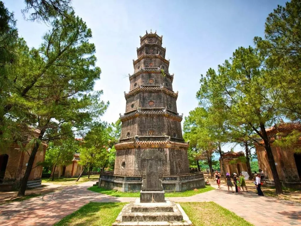 A view of Thien Mu Pagoda surrounded by nature, highlighting its significance and beauty.