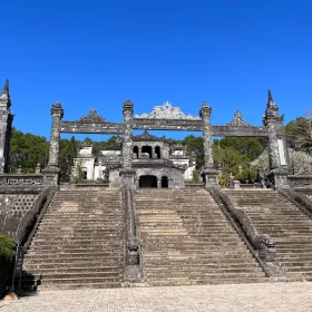 Tomb of Khai Dinh on a mountainside in Hue with intricate architecture and panoramic views.