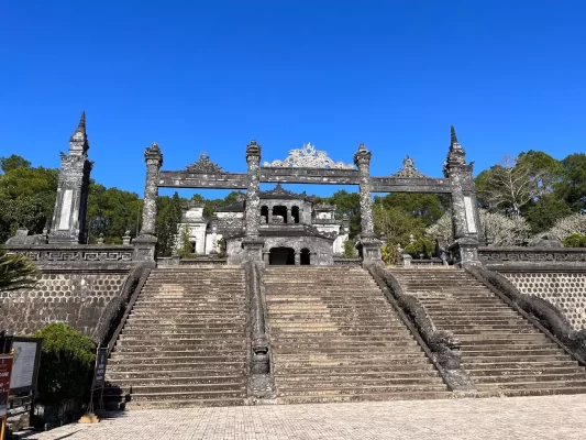 Tomb of Khai Dinh on a mountainside in Hue with intricate architecture and panoramic views.