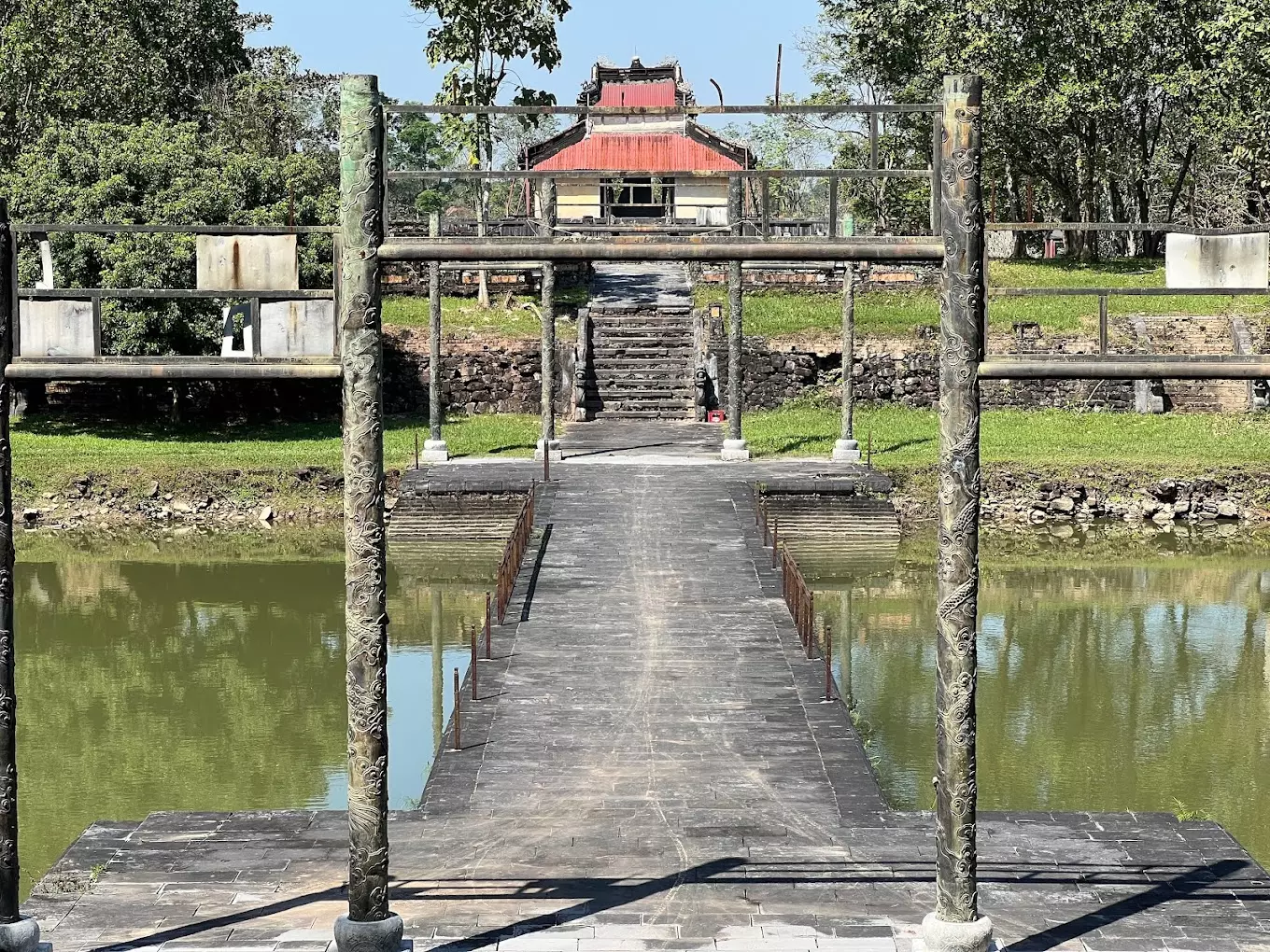 Tomb of Thieu Tri in Hue with picturesque rice fields and hills, showcasing its serene natural beauty.