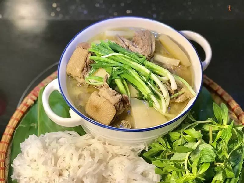 Rustic Hue dishes served at Thanh Toan Bridge, featuring fresh local ingredients like duck, chicken, shrimp, and fish.