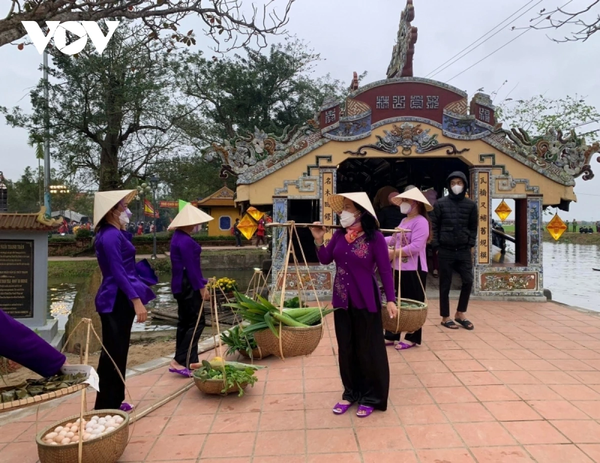 Village market at Thanh Toan Bridge, Hue, showcasing local food, cultural activities, and traditional games.