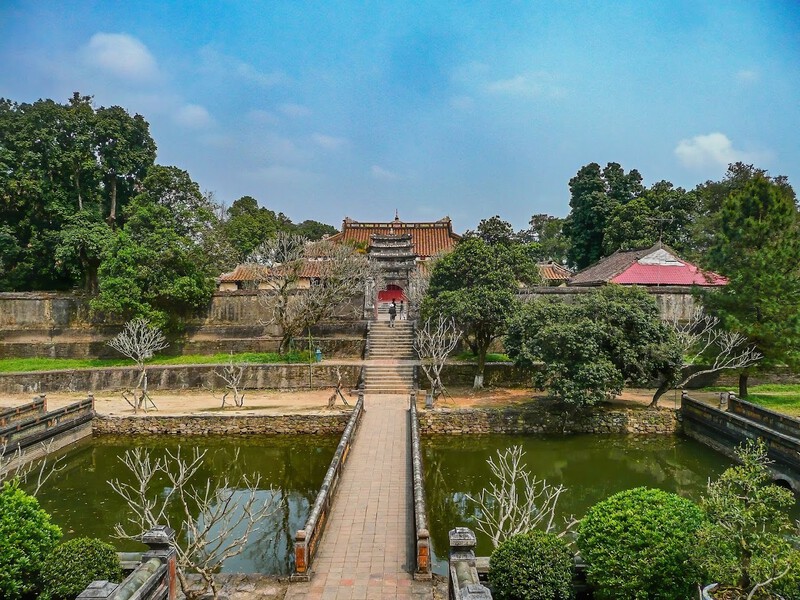 A scenic view of Tu Duc Tomb in Hue during the cool season from January to February, showcasing the tranquil atmosphere and perfect weather for tourists.