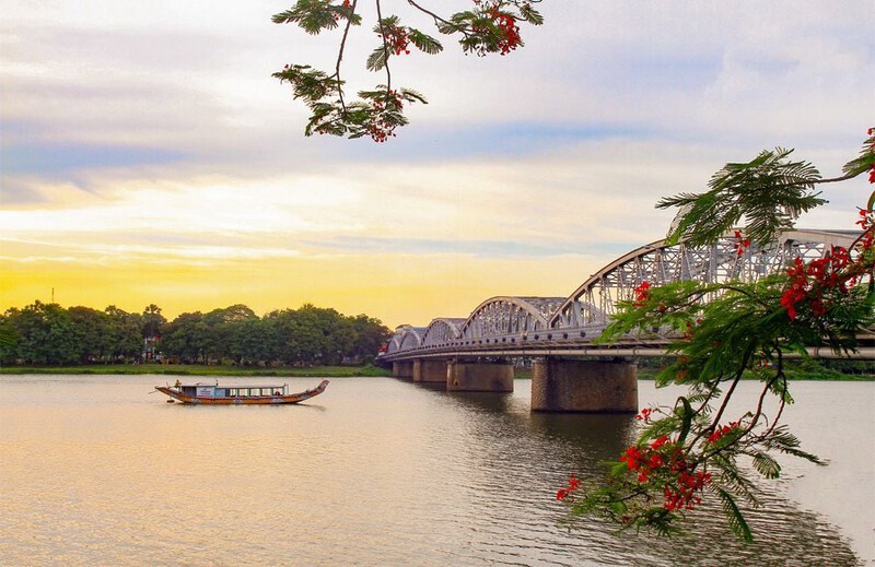 Truong Tien Bridge over the Huong River, with the reflection of the bridge on the water.